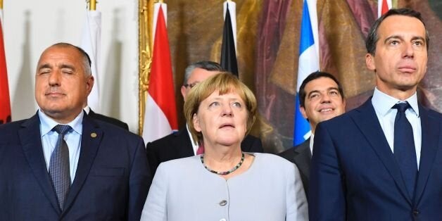 (L to R) Bulgaria's Prime minister Boyko Borissov, German chancellor Angela Merkel and Austrian chancellor Christian Kern pose for a family photo after a meeting on the Balkan migrant route into the EU in Vienna on September 24, 2016. / AFP / JOE KLAMAR (Photo credit should read JOE KLAMAR/AFP/Getty Images)