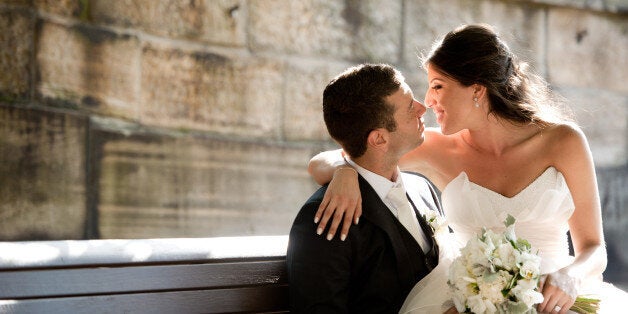 Bride sitting on groom's lap