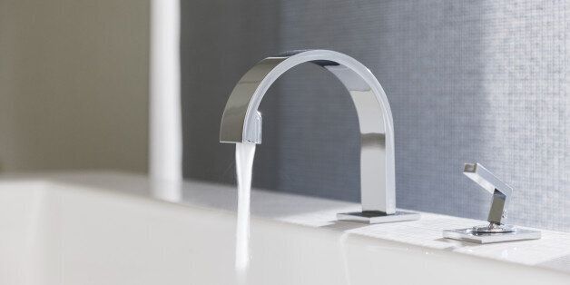 Water emitting from modern faucet