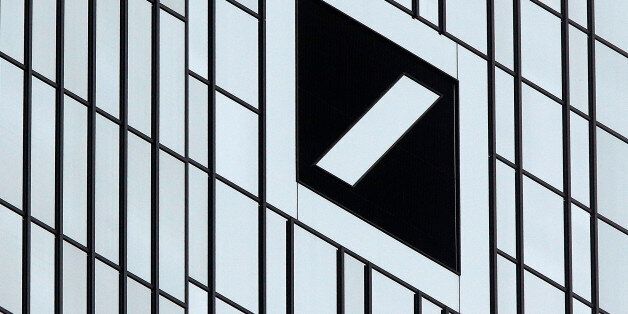 The bank's logo is pictured at the headquarters of Deutsche Bank in Frankfurt, Germany, Friday, Sept. 30, 2016. Worries over the financial health of Deutsche Bank returned to the fore Friday, sending the company's share price into a tailspin and to a record low. (AP Photo/Michael Probst)