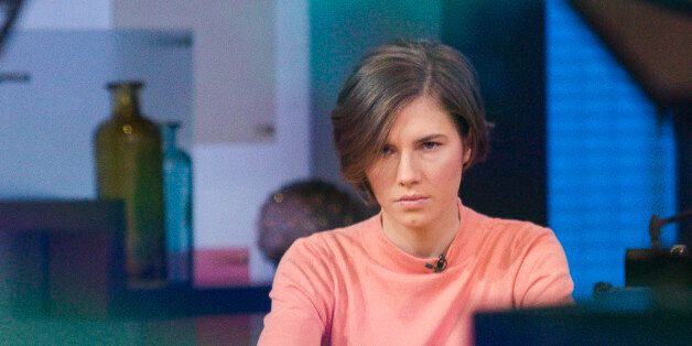 Amanda Knox sits alone before being interviewed on the set of ABC's