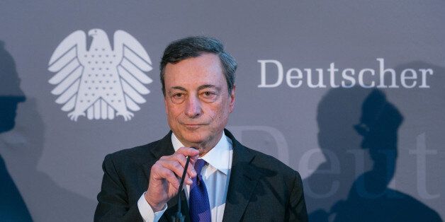 Mario Draghi, president of the European Central Bank (ECB), listens during a news conference in Berlin, Germany, on Wednesday, Sept. 28, 2016. Draghi vigorously defended his stimulus policies to critical lawmakers in Berlin, while reaffirming the urgency to step up structural reforms. Photographer: Krisztian Bocsi/Bloomberg via Getty Images