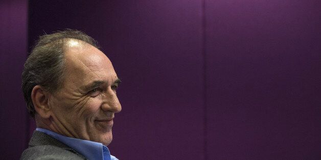 George Stathakis, Greece's economy minister, reacts during an interview in Athens, Greece, on Monday, Feb. 15, 2016. Greece, struggling with more than 100 billion euros ($112 billion) of soured loans, wants to cap distressed debt sales, the countrys economy minister said. Photographer: Yorgos Karahalis/Bloomberg via Getty Images