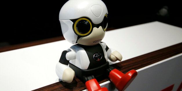 In this Sept. 27, 2016 photo, Toyota Motor Corp.'s Kirobo Mini, a compact sized humanoid communication robot, sits during a press unveiling in Tokyo. The new robot from Japanese automaker Toyota Motor Corp. can't do much but chatter in a high-pitched voice. (AP Photo/Shizuo Kambayashi)
