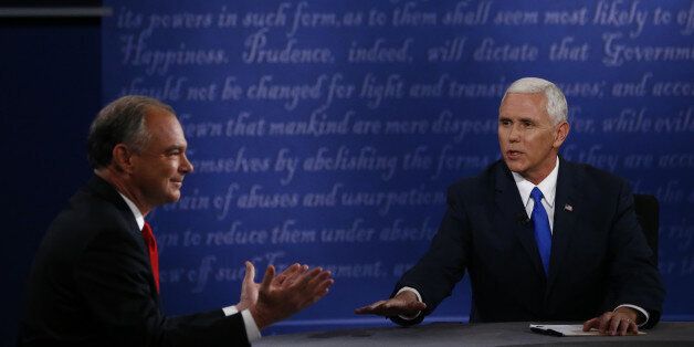 Mike Pence, 2016 Republican vice presidential nominee, right, speaks as Tim Kaine, 2016 Democratic vice presidential nominee, gestures during the vice presidential debate at Longwood University in Farmville, Virginia, U.S., on Tuesday, Oct. 4, 2016. Indiana Governor Mike Pence and Virginia Senator Tim Kaine arrive at tonight's debate with three main assignments: defend their bosses from attack, try to land a few blows, and avoid any mistakes showing them unfit to be president. Photographer: Andrew Harrer/Bloomberg via Getty Images
