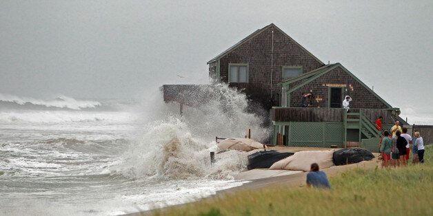 NANTUCKET, MA - SEPTEMBER 3: Neighbors gather to watch Gene Ratner's home on Sheep Pond Road get slammed by the waves created by Hurricane Earl on Friday, September 3, 2010. (Photo by Matthew J. Lee/The Boston Globe via Getty Images)
