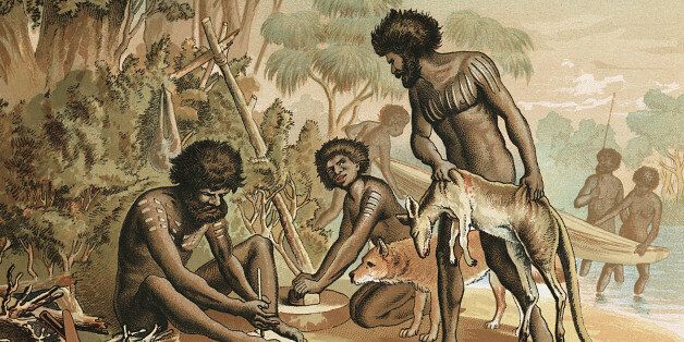 Australian aborigines with kangaroo carcass