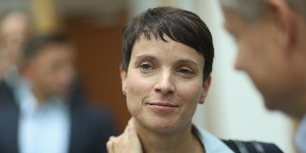 BERLIN, GERMANY - SEPTEMBER 05: Frauke Petry, co-head of the Alternative fuer Deutschland (AfD) political party, speaks to a journalist following an AfD press conference on September 5, 2016 in Berlin, Germany. The AfD, a newcomer populist party that has managed to gain a strong following nationwide with an immigration-critical platform, made waves the day before by winning second place in state elections in Mecklenburg-Western Pomerania. (Photo by Sean Gallup/Getty Images)