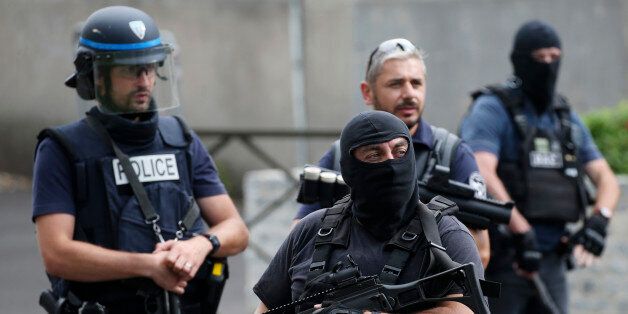 French police and anti-crime brigade (BAC) members secure a street as they carried out a counter-terrorism swoop at different locations in Argenteuil, a suburb north of Paris, France, July 21, 2016. REUTERS/Charles Platiau