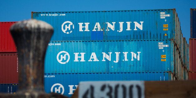 Containers sit stacked on the Hanjin Gdynia cargo ship berthed at the Port of Long Beach in Long Beach, California, U.S., on Thursday, Sept. 15, 2016. Bankrupt Hanjin Shipping Co.'s efforts to unload vessels in the U.S. while it goes through bankruptcy in South Korea are meeting with complaints from cargo owners and from the companies that service and equip its fleet. Photographer: Tim Rue/Bloomberg via Getty Images