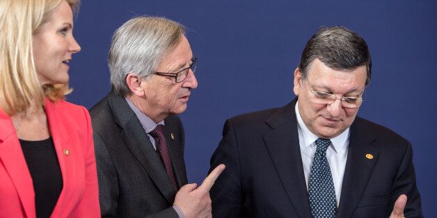 Denmark's Prime Minister Helle Thorning-Schmidt, left, looks at Luxembourg's Prime Minister Jean-Claude Juncker, center, and European Commission President Jose Manuel Barroso while they walk away after a group photo was taken during an EU summit in Brussels on Wednesday, May 22, 2013. Leaders from the 27 European Union countries gather in Brussels for one of their regular European Council sessions. On the agenda is the increasingly controversial subject of tax evasion. Countries such as Austria and Luxembourg which have lucrative, and somewhat opaque, banking systems have begun to fight back against efforts to improve the transparency of the EU's financial system.(AP Photo/Geert Vanden Wijngaert)