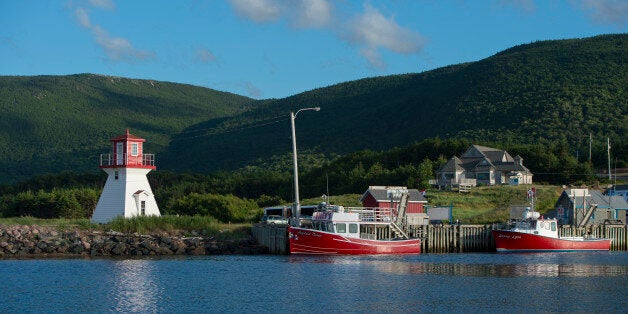 CANADA - 2012/01/01: Fishing port of Pleasant Bay with lighthouse along the west coast of Cape Breton Island, Nova Scotia, Canada. (Photo by Wolfgang Kaehler/LightRocket via Getty Images)