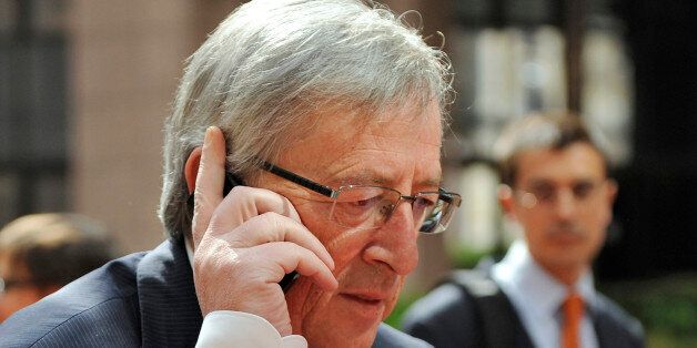 Eurogroup president and Luxembourg Prime Minister Jean-Claude Juncker phones as he arrives prior to an Extraordinary Eurogroup meeting on the Greek crisis, on May 2, 2010 at EU Headquarters in Brussels. AFP PHOTO/ JEAN-CHRISTOPHE VERHAEGEN (Photo credit should read JEAN-CHRISTOPHE VERHAEGEN/AFP/Getty Images)