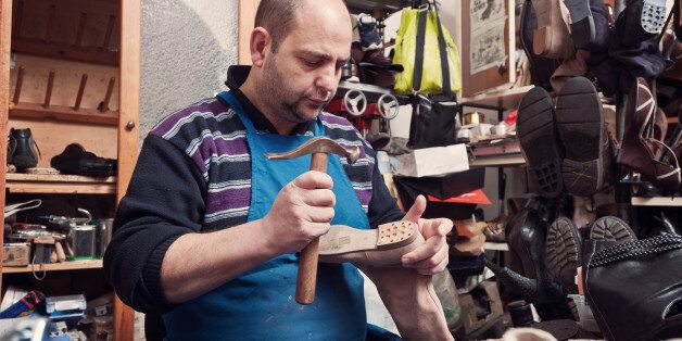 Cobbler at work with a hammer