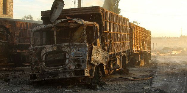 Damaged aid trucks are pictured after an airstrike on the rebel held Urm al-Kubra town, western Aleppo city, Syria September 20, 2016. REUTERS/Ammar Abdullah