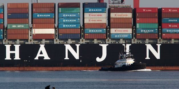 A tug boat pulls away from the Hanjin Greece container ship after it docked for unloading at the Port of Long Beach, California, on September 10, 2016. The ship had been stranded at sea for more than a week for fear that it could be seized by creditors if it came to shore.A Hanjin Shipping spokesman said a US court had issued an order allowing it to unload some cargo without fear of creditors seizing its ships. As of late September 9, 92 of 141 ships being operated by the world's seventh largest shipping firm were stranded at sea. / AFP / DAVID MCNEW (Photo credit should read DAVID MCNEW/AFP/Getty Images)