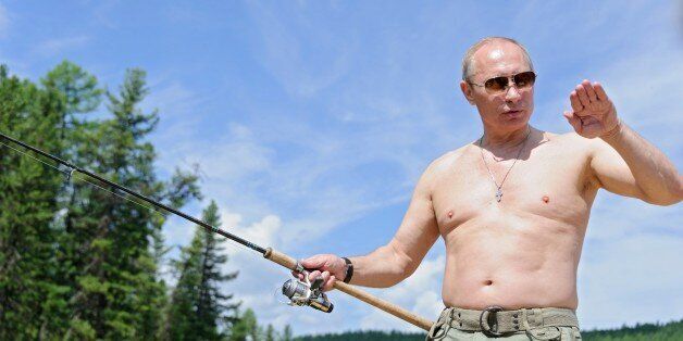 This picture made available on July 26, 2013 shows Russian President Vladimir Putin fishing in the Tyva region on July 20, 2013 during his vacation. AFP PHOTO/ RIA-NOVOSTI/ ALEXEY DRUZHININ (Photo credit should read ALEXEY DRUZHININ/AFP/Getty Images)