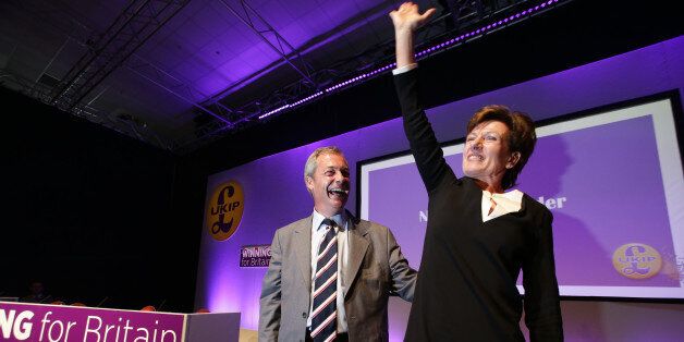 Outgoinng leader Nigel Farage (L) looks on as he instroduces new leader of the anti-EU UK Independence Party (UKIP) Diane James (R) at the UKIP Autumn Conference in Bournemouth, on the southern coast of England, on September 16, 2016. Diane James was announced as UKIP's new leader on September 16 to replace charismatic figurehead Nigel Farage. Farage made the shock decision to quit as leader of the UK Independence Party following victory in the referendum on Britain's membership of the European Union. / AFP / Daniel Leal-Olivas (Photo credit should read DANIEL LEAL-OLIVAS/AFP/Getty Images)