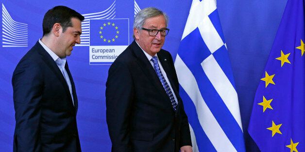 Greek Prime Minister Alexis Tsipras (L) is welcomed by European Commission President Jean-Claude Juncker (R) ahead of a meeting at the EU Commission headquarters in Brussels, Belgium February 17, 2016. REUTERS/Yves Herman