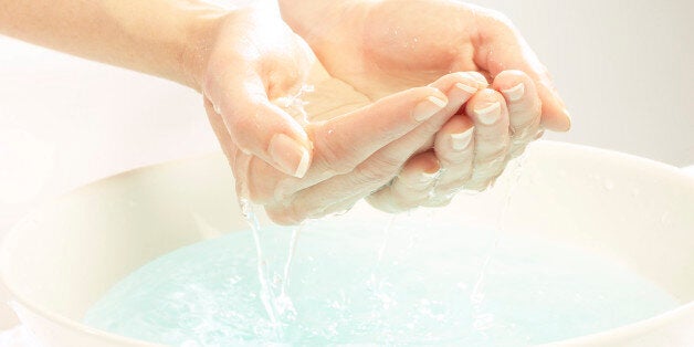 Hands cupping water