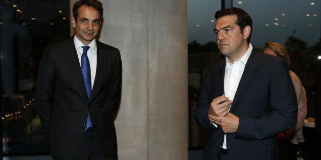Leader of main opposition New Democracy Kyriakos Mitsotakis (L) and Greek PM Alexis Tsipras wait to receive UN Secretary General, at the Acropolis Museum . In Athens, on June 17, 2016. (Photo by Panayiotis Tzamaros/NurPhoto via Getty Images)