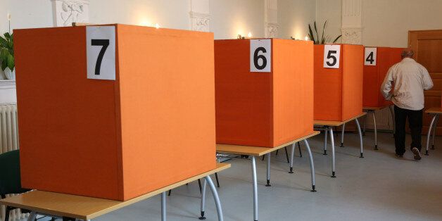 This picture shows a polling station at the House of VolkssolidariÃ¤t in Neustrelitz Mecklenburg-Western Pomerania, eastern Germany, on September 4, 2016.Around 1.33 million voters are electing a new regional parliament for the northeastern state of Mecklenburg-Western Pomerania, which is also home to Merkel's constituency Stralsund. Chancellor Angela Merkel's party braced for a backlash at state polls Sunday, while anti-migrant populists are poised for major gains a year after the German leader opened the borders to refugees. / AFP / dpa / Bernd WÃ¼stneck / Germany OUT (Photo credit should read BERND WUSTNECK/AFP/Getty Images)