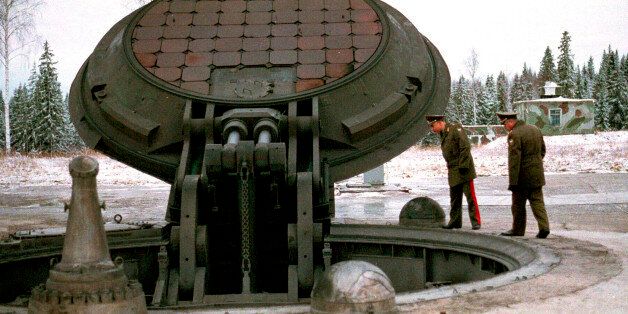 Russian military officials, no names given, look into an open silo of an intercontinental ballistic Topol-M missile at an undisclosed location in Russia in this 2001 photo. Russia has deployed a fresh batch of its top-of-the-line strategic nuclear missiles after a break caused by a funding shortage, said military officials on Monday, Dec. 22, 2003. (AP Photo)