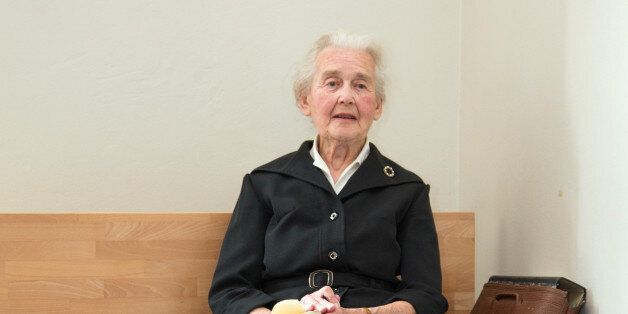87-year-old defendant Ursula Haverbeck is sitting in front of the conference room of the state court in Detmold, Germany, Sept. 2, 2016. The prominent German neo-Nazi has again been convicted of Holocaust denial and sentenced to eight months in prison. (Friso Gentsch/dpa via AP)
