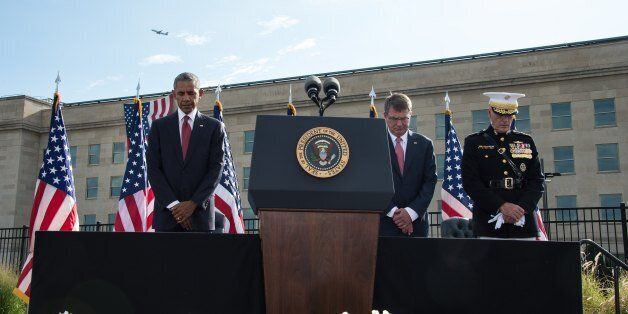 US President Barack Obama (L), Defense Secretary Ashton Carter (2nd R) and Joint Chiefs of Staff Gen. Joseph Dunford (R) attend a ceremony commemorating the September 11, 2001 attacks at the Pentagon in Washington, DC, on September 11, 2016. / AFP / NICHOLAS KAMM (Photo credit should read NICHOLAS KAMM/AFP/Getty Images)