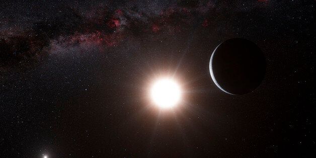 This artist's impression shows the planet orbiting the star Alpha Centauri B, a member of the triple star system that is the closest to Earth in this image released on October 17, 2012. Alpha Centauri B is the most brilliant object in the sky and the other dazzling object is Alpha Centauri A. Our own Sun is visible to the upper right. It is also the lightest exoplanet ever discovered around a star like the Sun. The planet was detected using the HARPS instrument on the 3.6-metre telescope at ESO?s La Silla Observatory in Chile. REUTERS/ESO/L. Calcada/N. Risinger (skysurvey.org)/Handout (SPACE - Tags: ENVIRONMENT SCIENCE TECHNOLOGY) FOR EDITORIAL USE ONLY. NOT FOR SALE FOR MARKETING OR ADVERTISING CAMPAIGNS. THIS IMAGE HAS BEEN SUPPLIED BY A THIRD PARTY. IT IS DISTRIBUTED, EXACTLY AS RECEIVED BY REUTERS, AS A SERVICE TO CLIENTS