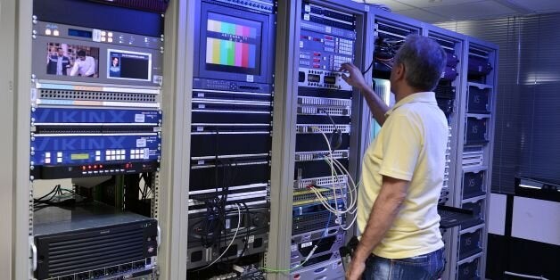 A technician works at the master control room of the private braodcaster Antenna in Athens northern suburb on September 2, 2016. Greece raised 246 million euros ($274 million) on September 2, 2016 by auctioning four private TV licenses in a marathon bid dominated by shipowners including the boss of the country's top football club. Skai and Antenna, also owned by shipowning families, are the sole surviving members of the previous Greek TV cast. The government has said stations that broadcast nati