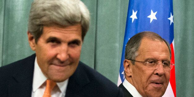 U.S. Secretary of State John Kerry, left, and Russian Foreign Minister Sergey Lavrov arrive to a news conference after their long talks in Moscow, Russia, Friday, July 15, 2016. The United States is offering Russia a broad new military partnership in Syria. (AP Photo/Alexander Zemlianichenko)