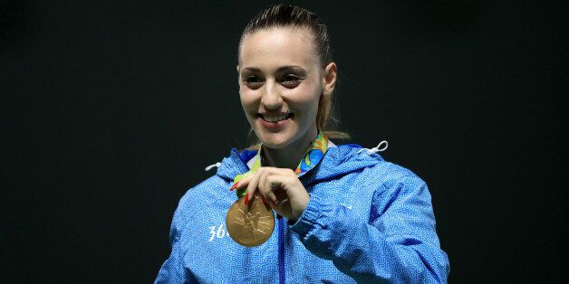 RIO DE JANEIRO, BRAZIL - AUGUST 09: Gold medalist Anna Korakaki of Greece smiles on the podium during the medal ceremony for the Women's 25m pistol event on Day 4 of the Rio 2016 Olympic Games at the Olympic Shooting Centre on August 9, 2016 in Rio de Janeiro, Brazil. (Photo by Sam Greenwood/Getty Images)