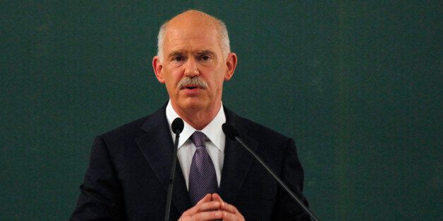 Former Greek Prime Minister George Papandreou speaks during a conference of the PASOK socialist party at Faliro, near Athens, Saturday, March 10 2012. Greece's private creditors agreed Friday to take cents on the euro in the biggest debt writedown in history, paving the way for an enormous second bailout for the country to keep Europe's economy from being dragged further into chaos. (AP Photo/Kostas Tsironis)