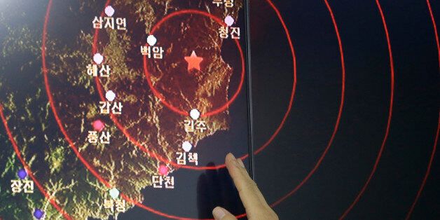 An official of the Earthquake and Volcano of the Korea Monitoring Division points at the epicenter of seismic waves in North Korea, in Seoul, South Korea, Friday, Sept. 9, 2016. South Korea's Yonhap news agency says Seoul believes North Korea has conducted its fifth nuclear test explosion. (AP Photo/Ahn Young-joon)