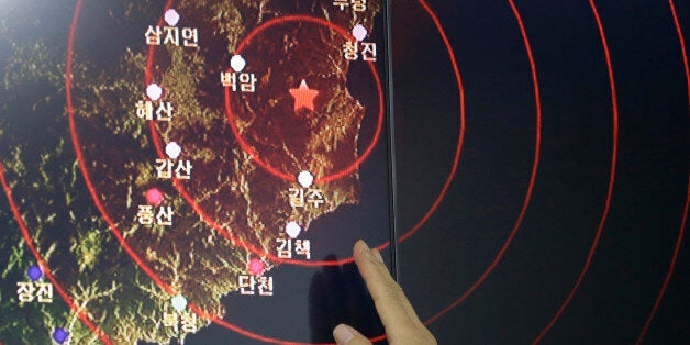 An official of the Earthquake and Volcano of the Korea Monitoring Division points at the epicenter of seismic waves in North Korea, in Seoul, South Korea, Friday, Sept. 9, 2016. South Korea's Yonhap news agency says Seoul believes North Korea has conducted its fifth nuclear test explosion. (AP Photo/Ahn Young-joon)