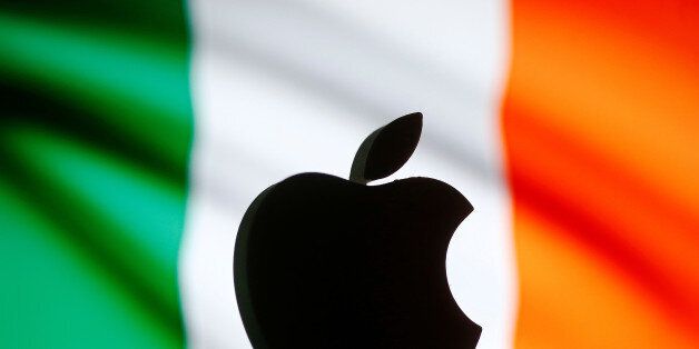 A 3D printed Apple logo is seen in front of a displayed European Union flag in this illustration taken September 2, 2016. REUTERS/Dado Ruvic/Illustration