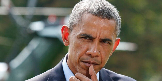 U.S. President Barack Obama pauses as he speaks to the media on the situation in Iraq on the South Lawn of the White House, before his departure for vacation at Martha's Vineyard, in Washington August 9, 2014. Obama said on Saturday U.S. airstrikes have destroyed arms and equipment that Islamic State insurgents could have used to attack Arbil, the Iraqi Kurdish capital, but warned the current operation in Iraq could take some time. REUTERS/Yuri Gripas (UNITED STATES - Tags: POLITICS CONFLICT TPX IMAGES OF THE DAY PROFILE)