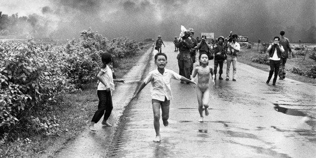 Vietnamese children flee from their homes in the South Vietnamese village of Trang Bang after South Vietnamese planes accidently dropped a napalm bomb on the village, located 26 miles outside of Saigon. Twenty-five years later, the young girl running naked from her village, Phan Thi Kim Phuc, was named UNESCO goodwill ambassador.