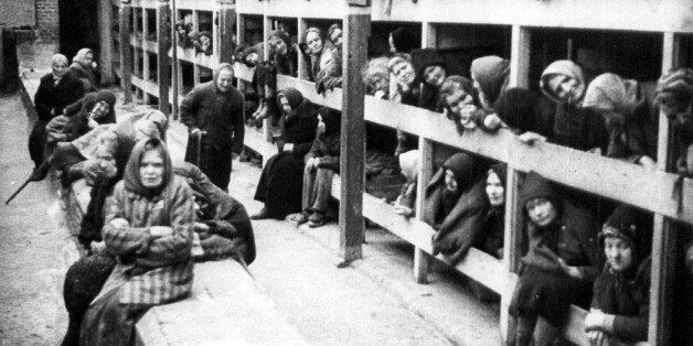 - PHOTO TAKEN JAN1945 - File photograph shows prisoners who survived the Nazi German Auschwitz death camp in Oswiecim, Poland, in their barracks shortly after the camp was freed. Some 7,000 prisoners, including more than 600 below the age of 18, were still alive when the camp was liberated. On January 27, 2005, hundreds of survivors and dozens of world leaders will commemorate the 60th anniversary of the camp's liberation by the Soviet army and pay homage to the estimate 1.5 million people, mostly Jews, murdered there by the Nazis. (Picture taken from a Soviet documentary of the liberation of Auschwitz in January 1945).??? USE ONLY