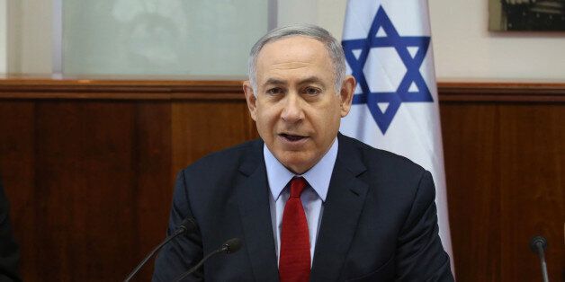 CORRECTS SIGN OFF SOURCE TO AP, NOT AFP - Israeli Prime Minister Benjamin Netanyahu, opens the weekly cabinet meeting at his Jerusalem office on Sunday, July 31, 2016. (Gali Tibbon, Pool via AP)