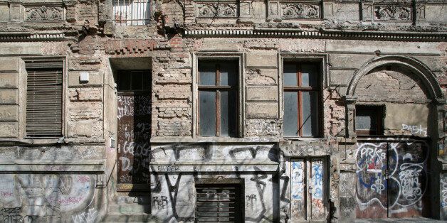 Run down facade of residential building in East Berlin, Germany