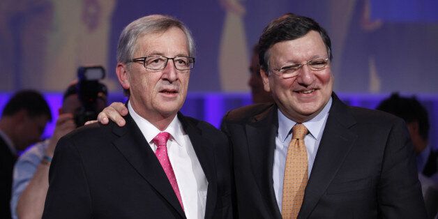 Jean-Claude Juncker, left, with Jose Manuel Barroso President of the European Commission, Conservative politicians from across Europe are electing their candidate to succeed Jose Manuel Barroso as president of the European Commission, the most powerful post in the European Union. after being voted as the next candidate for the president of the European commission, during the European People's Party Elections Congress at the convention centre, Dublin, Ireland, Friday, March 7, 2014. (AP Photo/Peter Morrison)