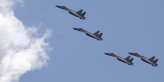 J-11B fighter jets of the Chinese Air Force fly in formation during a training session for the upcoming parade marking the 70th anniversary of the end of World War Two, on the outskirts of Beijing, July 2, 2015. Troops from Russia and Mongolia will march together with Chinese forces in a parade in Beijing in September to commemorate the end of World War Two, the government and state media said on Thursday, confirming the first two foreign participants. REUTERS/Jason Lee