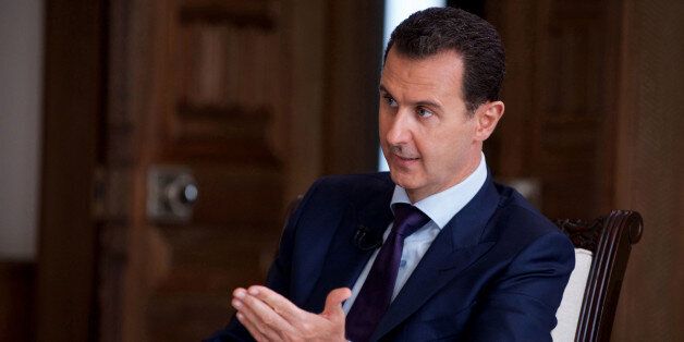 In this photo released on July 1, 2016, by the Syrian official news agency SANA, Syrian President Bashar Assad speaks during an interview with Australia's SBS news channel, in Damascus, Syria. Western nations publicly critical of Syrian President Bashar Assad's regime have been quietly sending security officials to collaborate with his government, Assad said in an interview broadcast Friday. (SANA via AP)