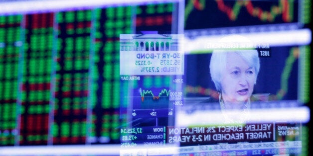 FILE - In this Wednesday, March 16, 2016, file photo, the Washington news conference of Federal Reserve Chair Janet Yellen is reflected in a specialist's screen on the floor of the New York Stock Exchange. Anyone trying to peg the likelihood of a Federal Reserve interest rate hike in 2016 has seen a topsy-turvy shift of expert opinion so far in the year. A bleak May jobs report and a panic that followed Britain's vote to quit the European Union had dimmed earlier expectations for a rate hike. But as the central bank meets the week of July 25, a resurgent U.S. economy and job market have led many to predict a Fed move by December if not sooner. (AP Photo/Richard Drew, File)