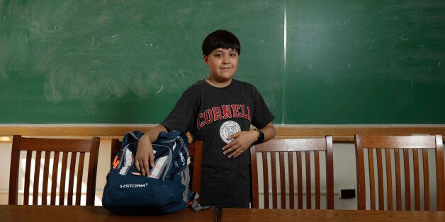 In this Friday, Aug. 26, 2016 photo, Jeremy Shuler, 12, a freshman at Cornell University, poses on campus in Ithaca, N.Y. Heâs the youngest student on record to attend the Ivy League school. (AP Photo/Mike Groll)