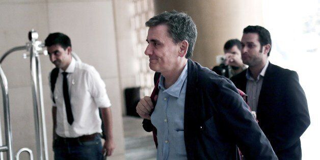 Greek Finance Minister Euclid Tsakalotos arrives for a meeting with representatives of the International Monetary Fund at a hotel in Athens, August 9, 2015. Greece and its creditors resumed talks in Athens on August 9, 2015 with both sides indicating that the terms of a third bailout will be finalised in short order. AFP PHOTO / ANGELOS TZORTZINIS (Photo credit should read ANGELOS TZORTZINIS/AFP/Getty Images)