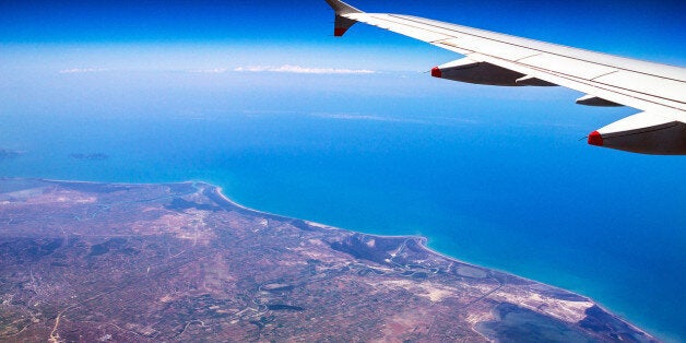 Flight Over Rhodes on deep blue sky background with soft focus