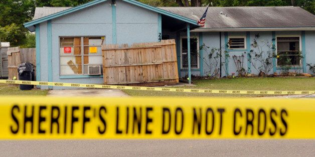 Police tape surrounds a home where a sinkhole opened up and swallowed a man in Seffner, Florida, March 1, 2013. The 36-year-old Florida man was feared dead on Friday after the sinkhole suddenly opened beneath the bedroom of his suburban Tampa home swallowing him, police and fire officials said. Rescuers responded to a 911 call late on Thursday after the man's family reported hearing a loud crash in the house and rushed to his bedroom. REUTERS/Brian Blanco (UNITED STATES - Tags: ENVIRONMENT DISASTER TPX IMAGES OF THE DAY)